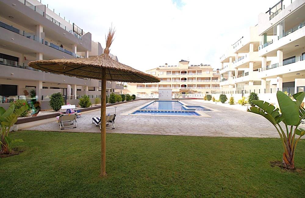 Ref: WV2622 — PLAYA FLAMENCA – 2 Bedrooms PentHouse with comm. Pool, Terrace, Solarium and Parking. | White Villas in Spain WhiteVillasInSpain02 23